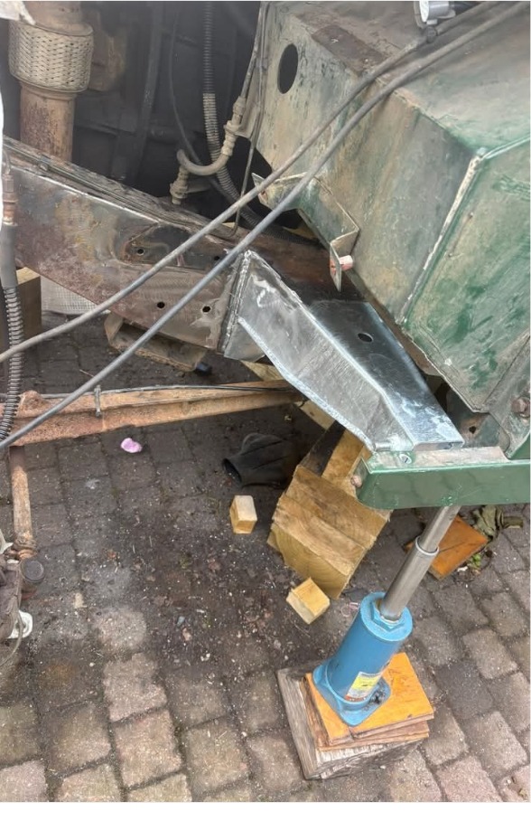 Newly welded galvanised outrigger fitted to a Land Rover Defender chassis