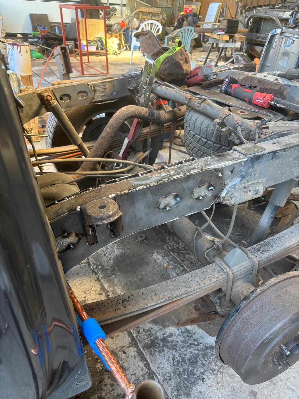 New steel plate welded onto a 4x4 chassis rail in the workshop